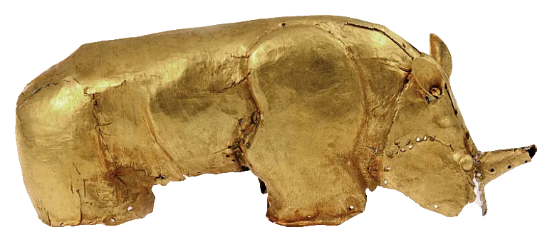 A small rhinoceros made of thin hammered gold, with one horn and short legs.